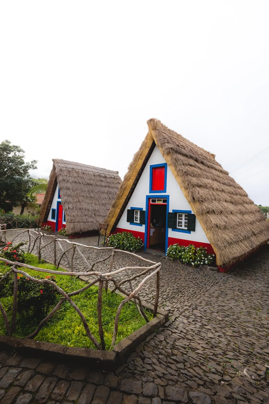 Traditional triangular A-frame houses with thatched roofs in Santana