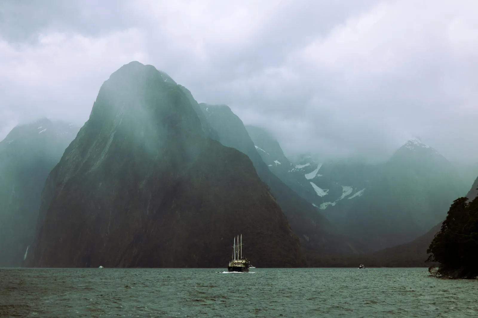 Mitre Peak rising from the still waters of Milford Sound, New Zealand.