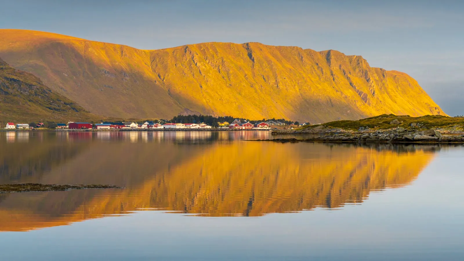 Norwegian landscape in golden autumn colours with snow-capped mountains