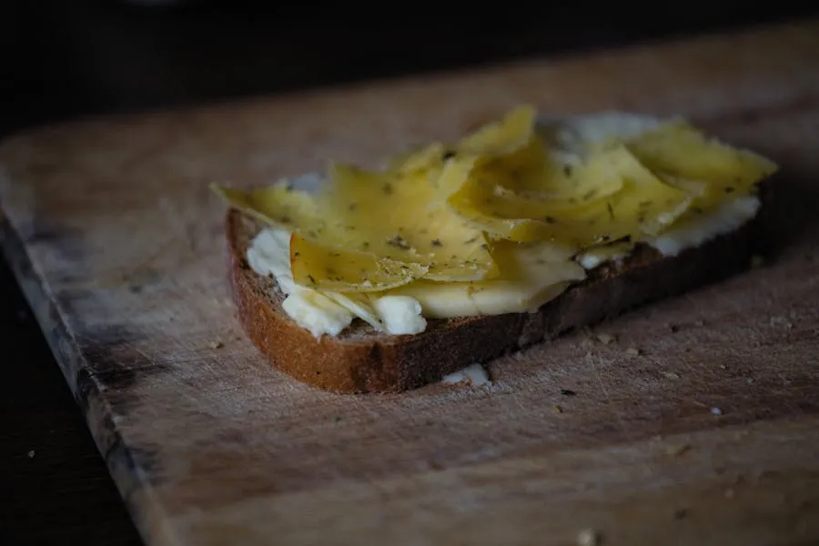 Slice of brown brunost cheese on Norwegian bread