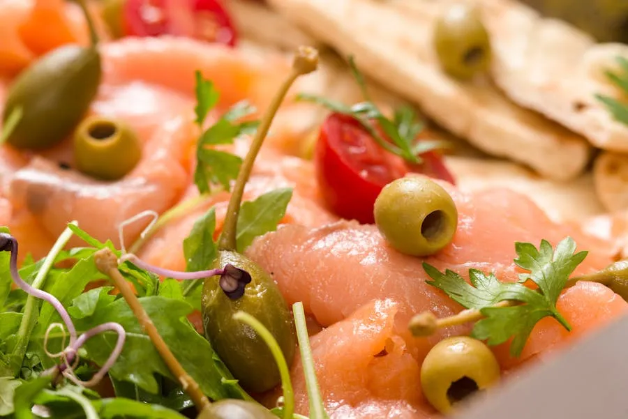 Plate of rakfisk fermented trout with flatbread and onions