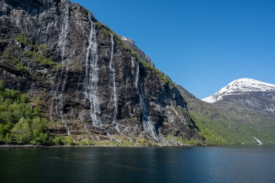 Geirangerfjord with Seven Sisters waterfall and deep blue water