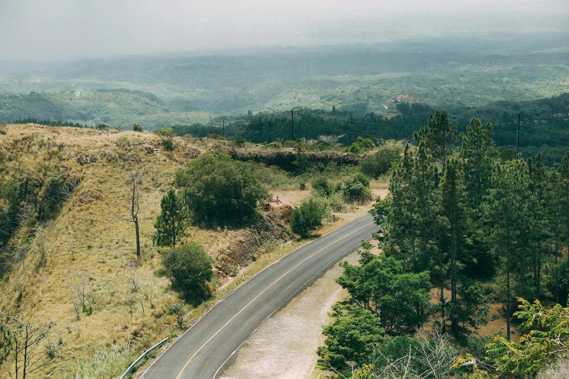 Explore the lush and mountainous landscape of El Valle de Antón with winding roads surrounded by greenery.