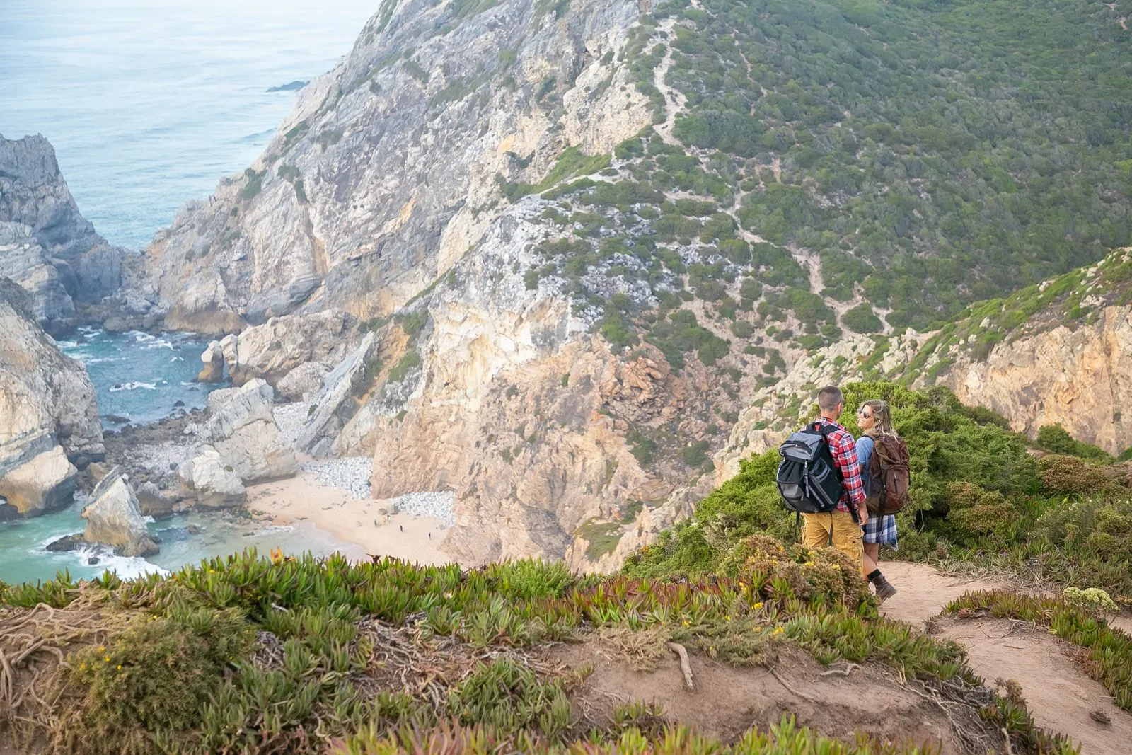Hikers on dramatic Rota Vicentina coastal trail above the Atlantic