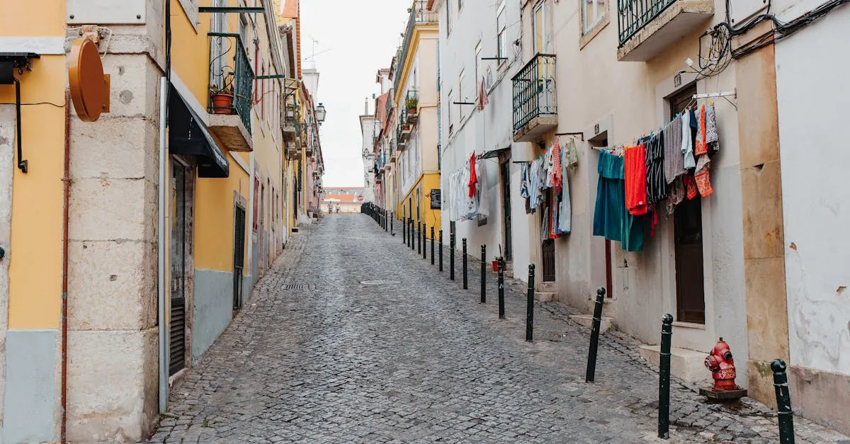 Narrow cobblestone alley in Alfama with hanging laundry