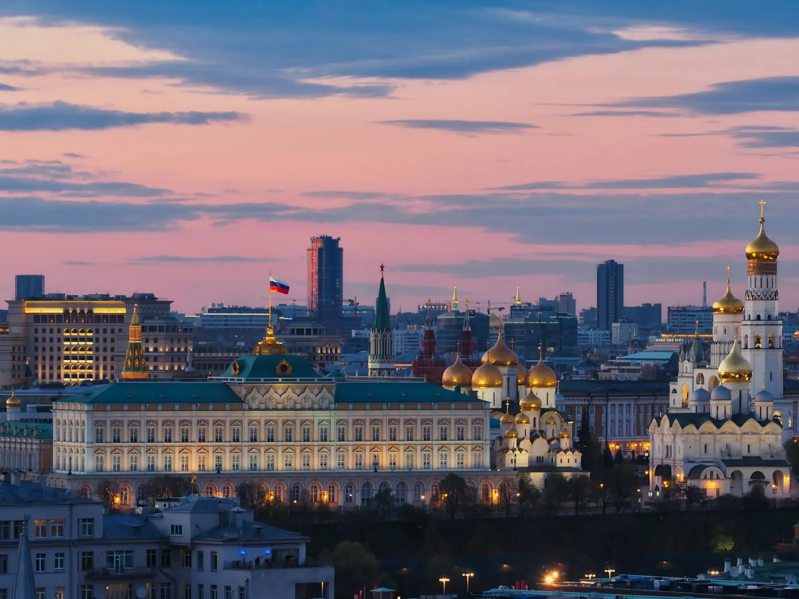 Golden sunset over Moscow skyline with church domes silhouetted