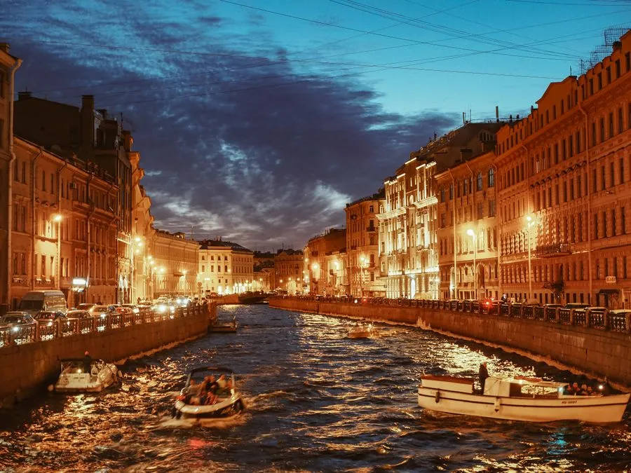 St Petersburg canal with baroque palaces and bridges at sunset