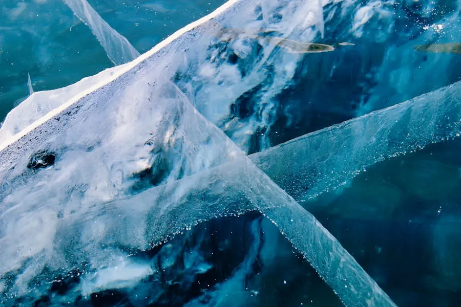 Crystal clear turquoise ice of frozen Lake Baikal with cracks and bubbles