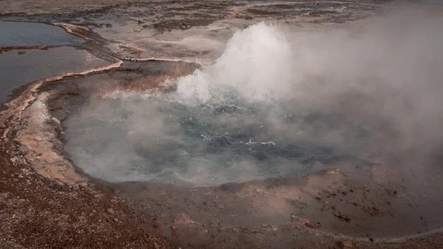 Valley of Geysers in Kamchatka with steam rising from the earth