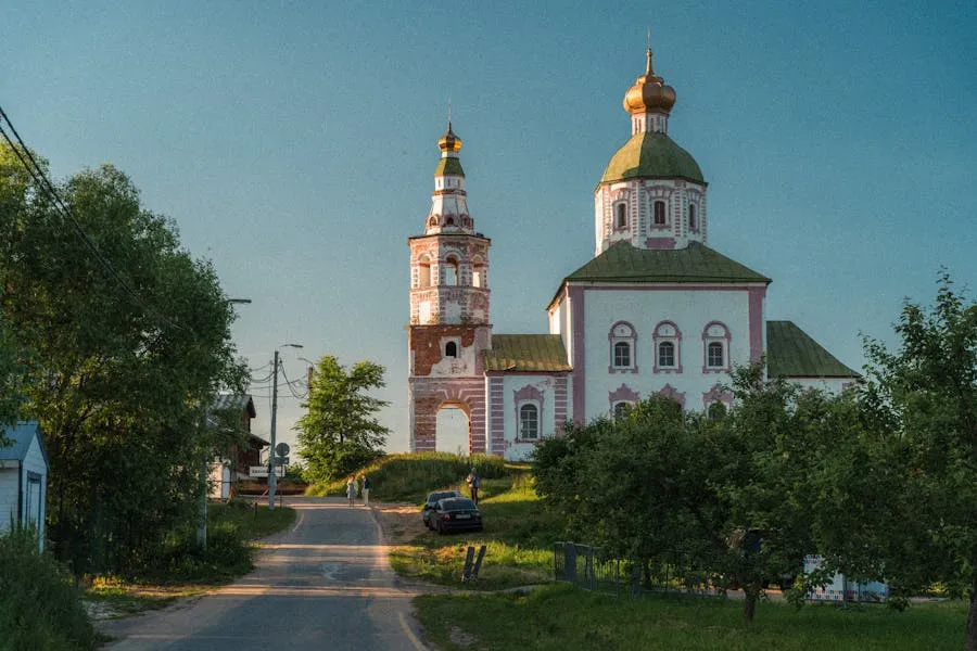 Suzdal panorama with golden-domed churches and green meadows