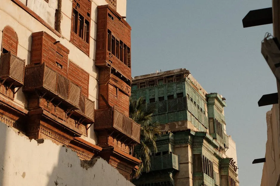 Narrow alley in Jeddah Al-Balad with coral-stone walls and wooden mashrabiya
