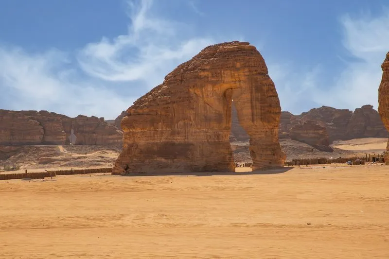 Elephant Rock sandstone formation under clear blue sky in AlUla desert