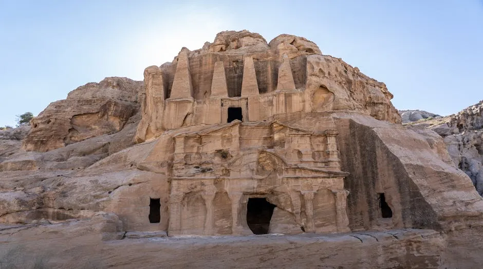 Row of carved Nabataean tomb facades at Hegra in AlUla