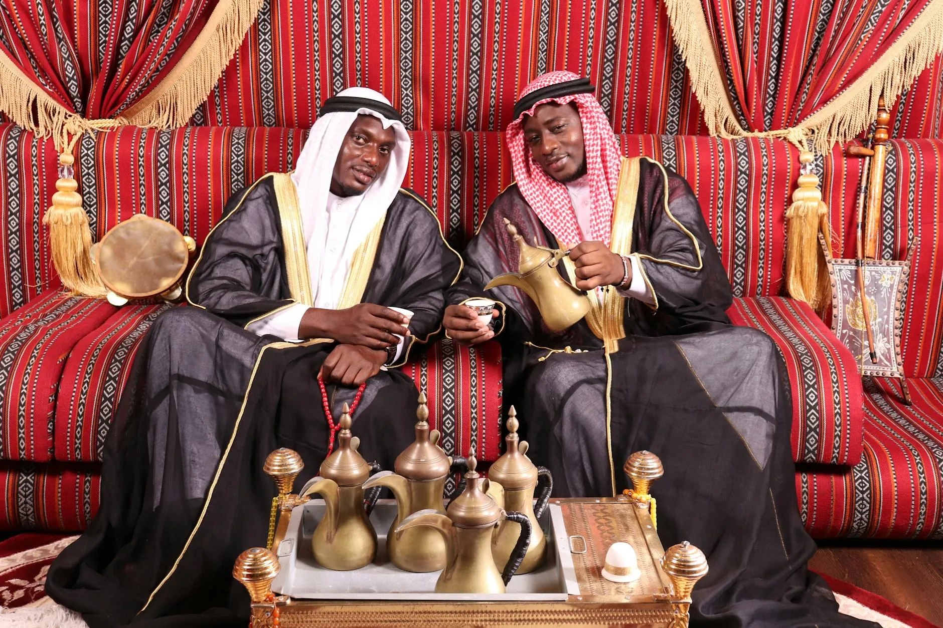 Traditional Arabic coffee ceremony with dallah pot and small cups on a tray