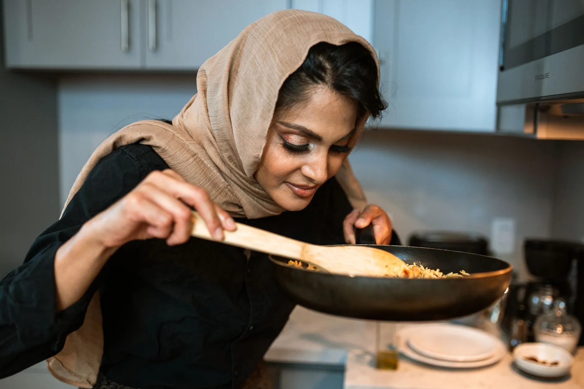 Large platter of kabsa with fragrant rice and roasted chicken served communally
