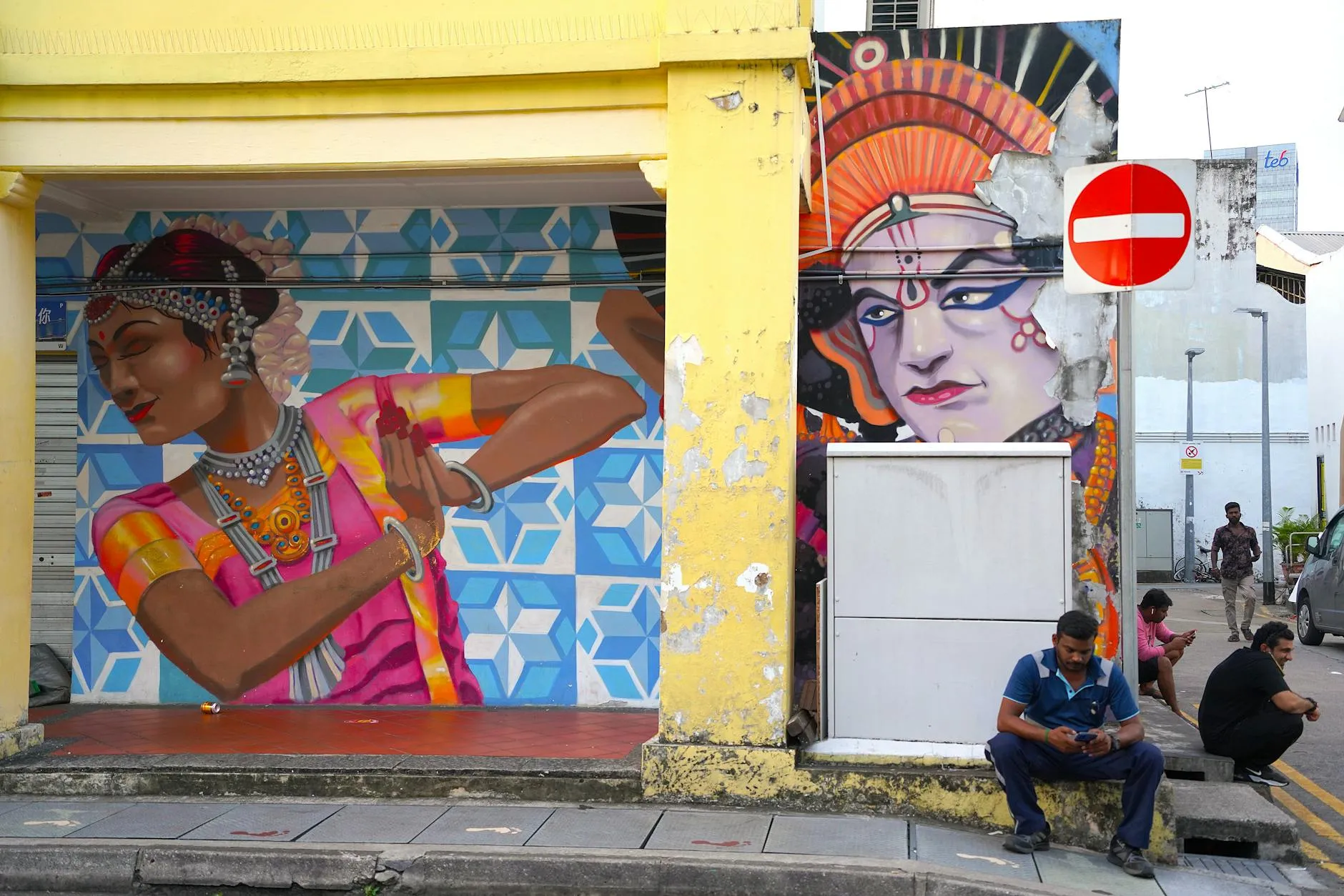 Vibrant street art in Little India, Singapore, featuring traditional Indian dancers.