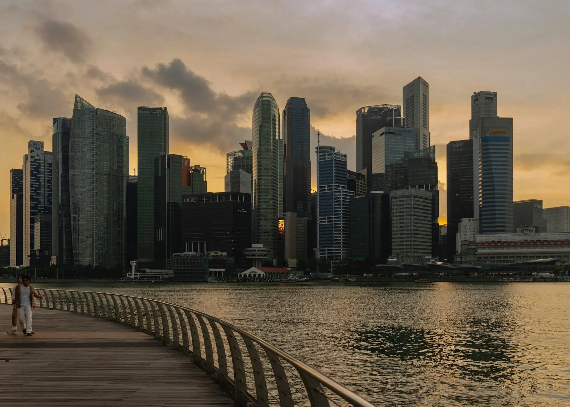 Captivating view of Singapore's skyline with reflections at sunset.