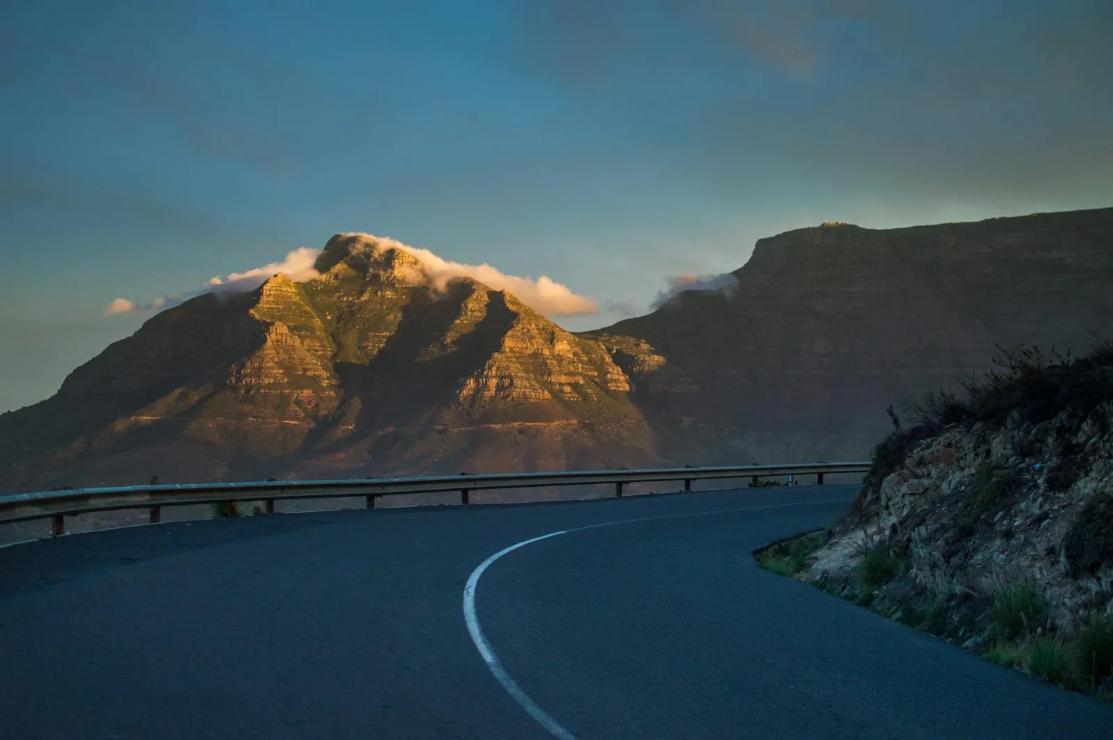 Coastal road near Cape Town with Table Mountain and the ocean