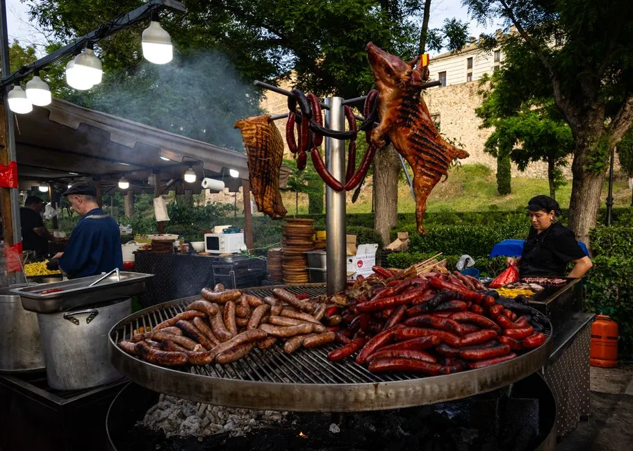 Golden roast cochinillo asado on a platter in Segovia