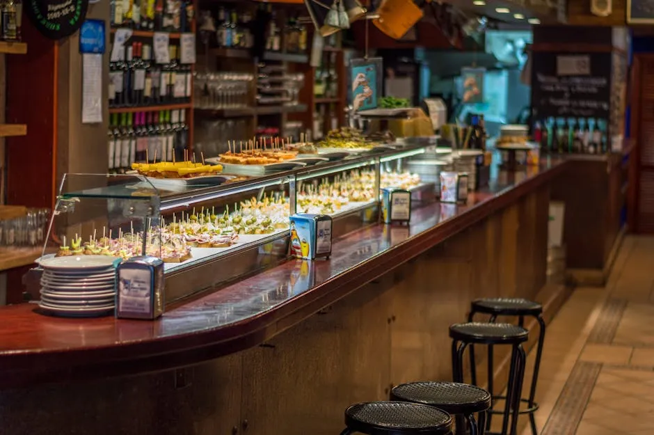 Colourful selection of Spanish tapas on small plates at a bar