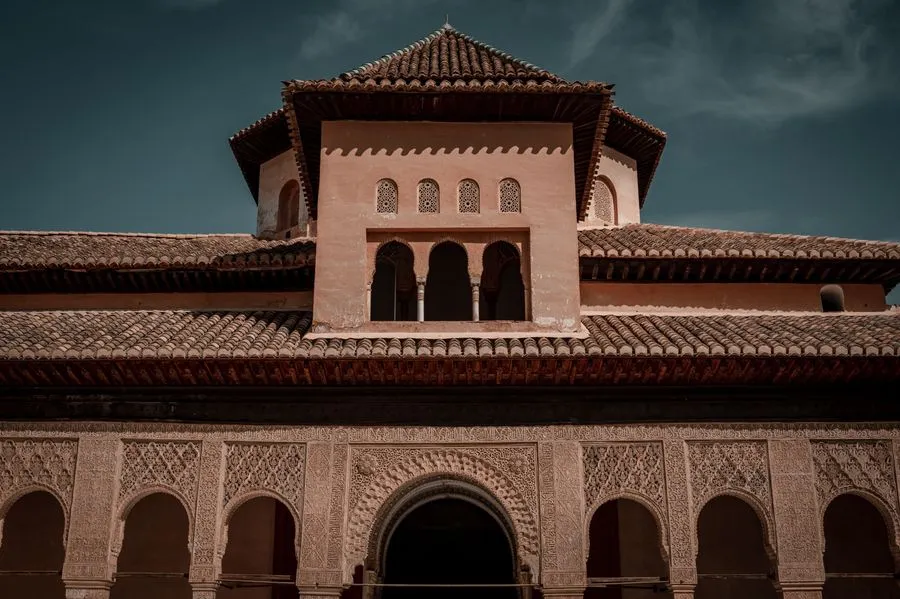 Ornate Islamic arches and courtyard gardens of the Alhambra palace