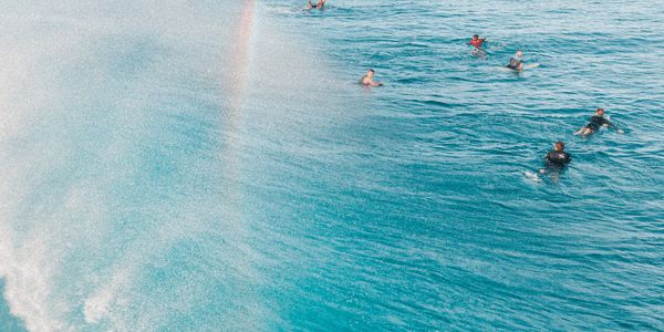 Aerial view of surfers at Kuta Beach, Bali