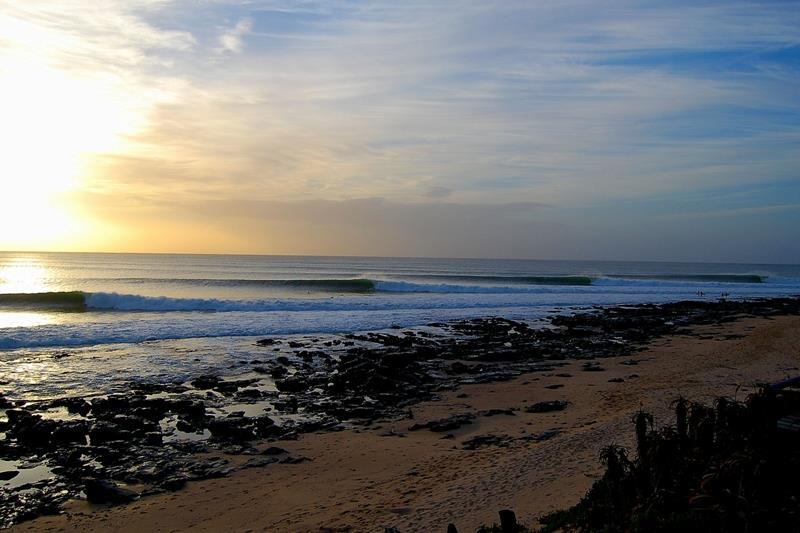 Point break at Jeffreys Bay, South Africa — a long, peeling wave along a rocky headland