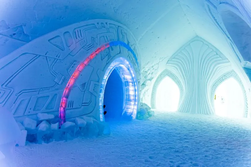 Ice-carved interior of the Icehotel in Jukkasjarvi with blue lighting