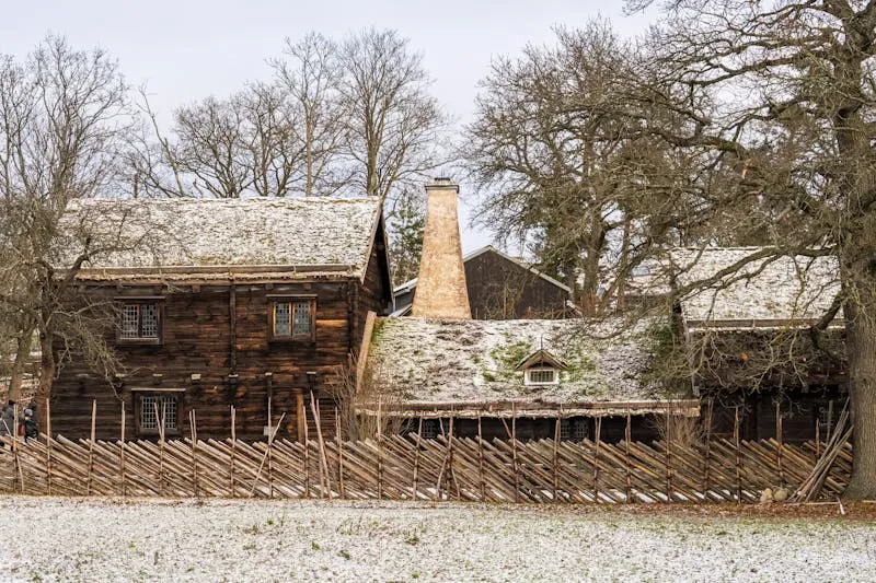 Historic wooden farmhouse at Skansen open-air museum with visitors