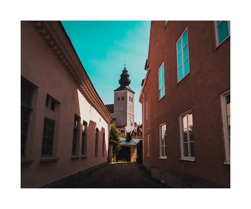 Medieval city wall towers of Visby on Gotland against sunset sky