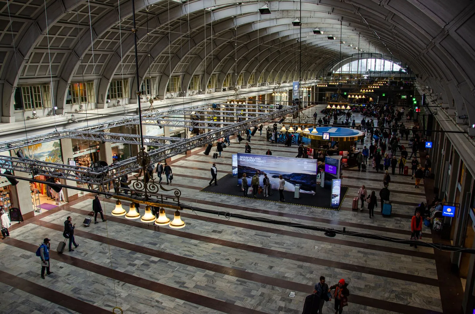 Overhead view of commuters moving through the spacious Stockholm Central Station
