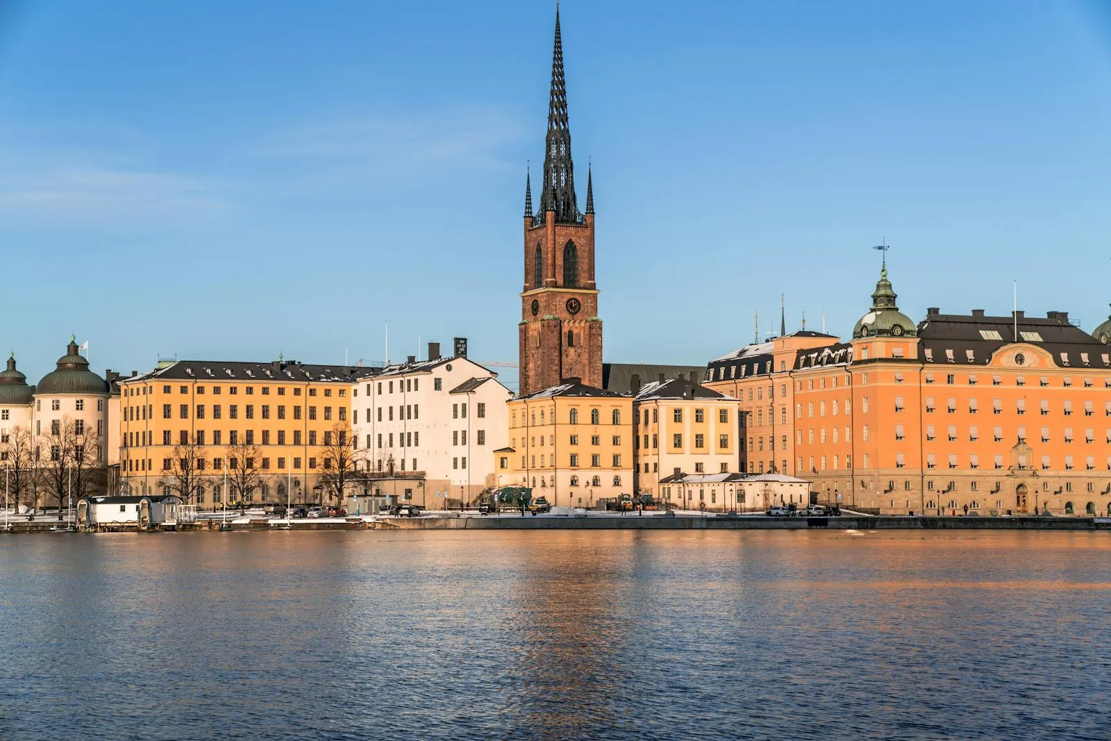 Colourful waterfront buildings of Gamla Stan in Stockholm reflecting in the water