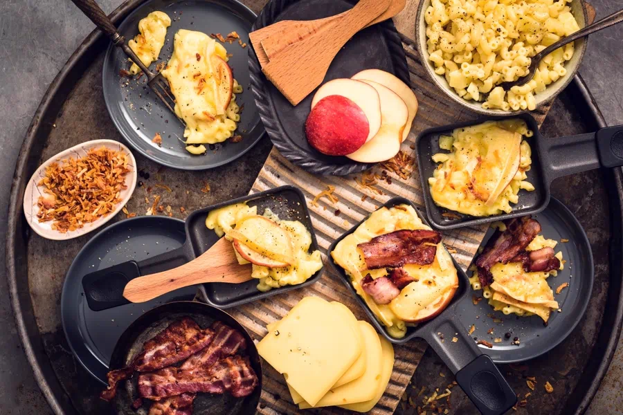 Raclette cheese being melted and scraped