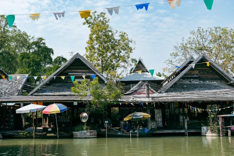Vendors in wooden boats selling food at a Thai floating market