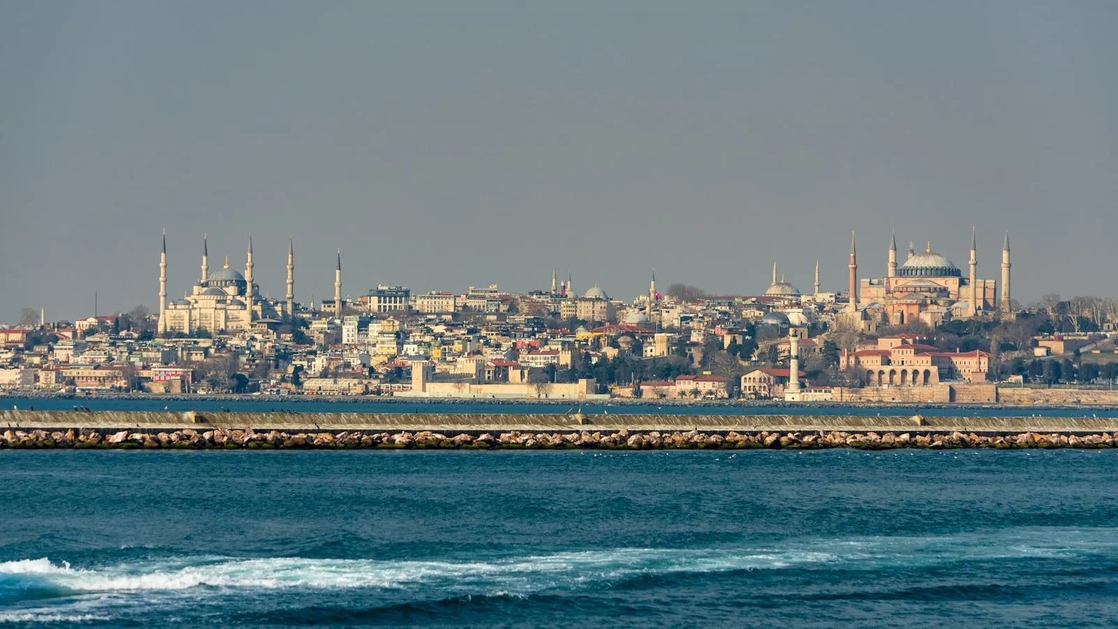 Epic panoramic skyline of Istanbul with mosques, minarets, and the Bosphorus at golden hour