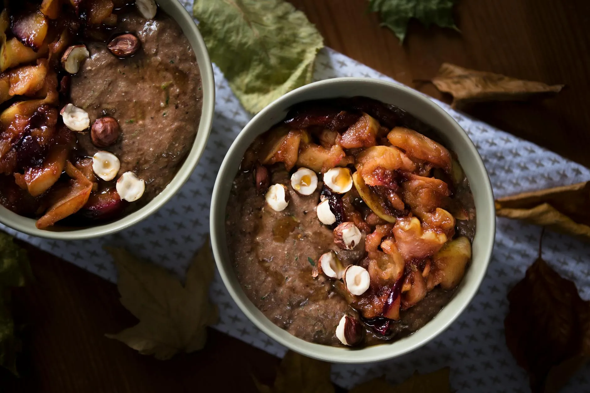 Bowl of harees porridge topped with cinnamon and ghee