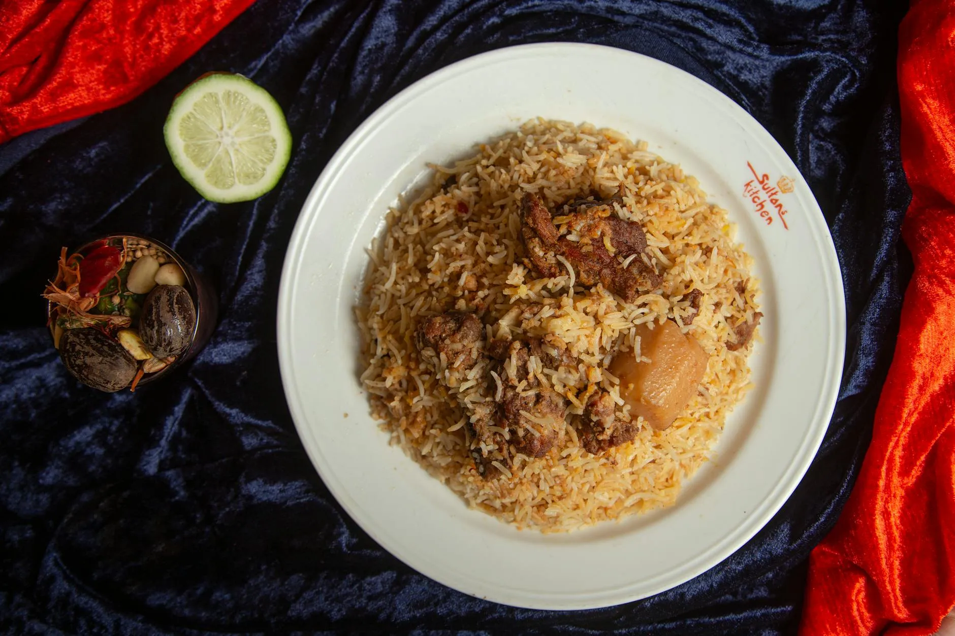 Machboos rice dish with spiced lamb and garnishes