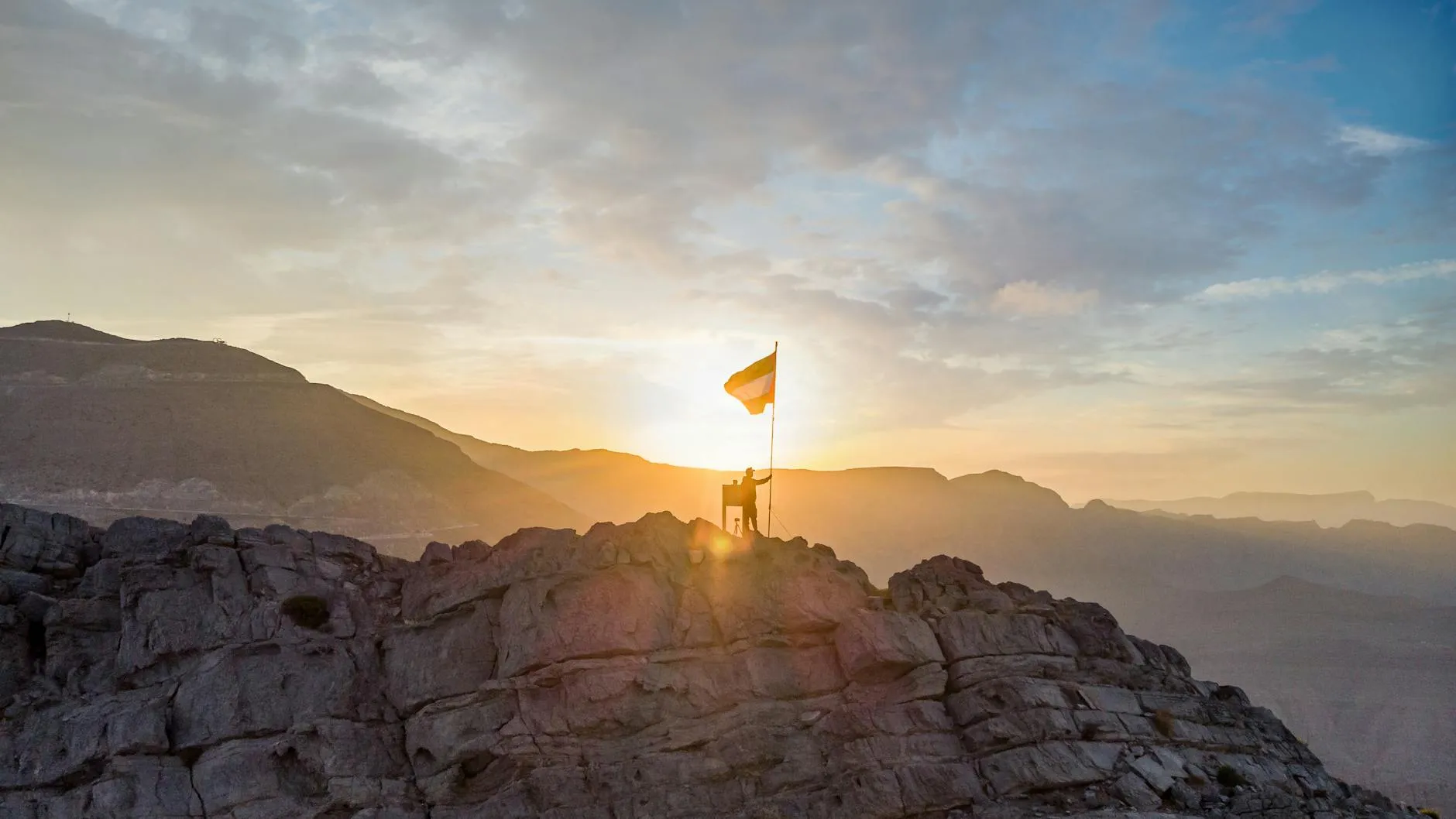 Jebel Jais mountain road with rugged peaks and desert valleys
