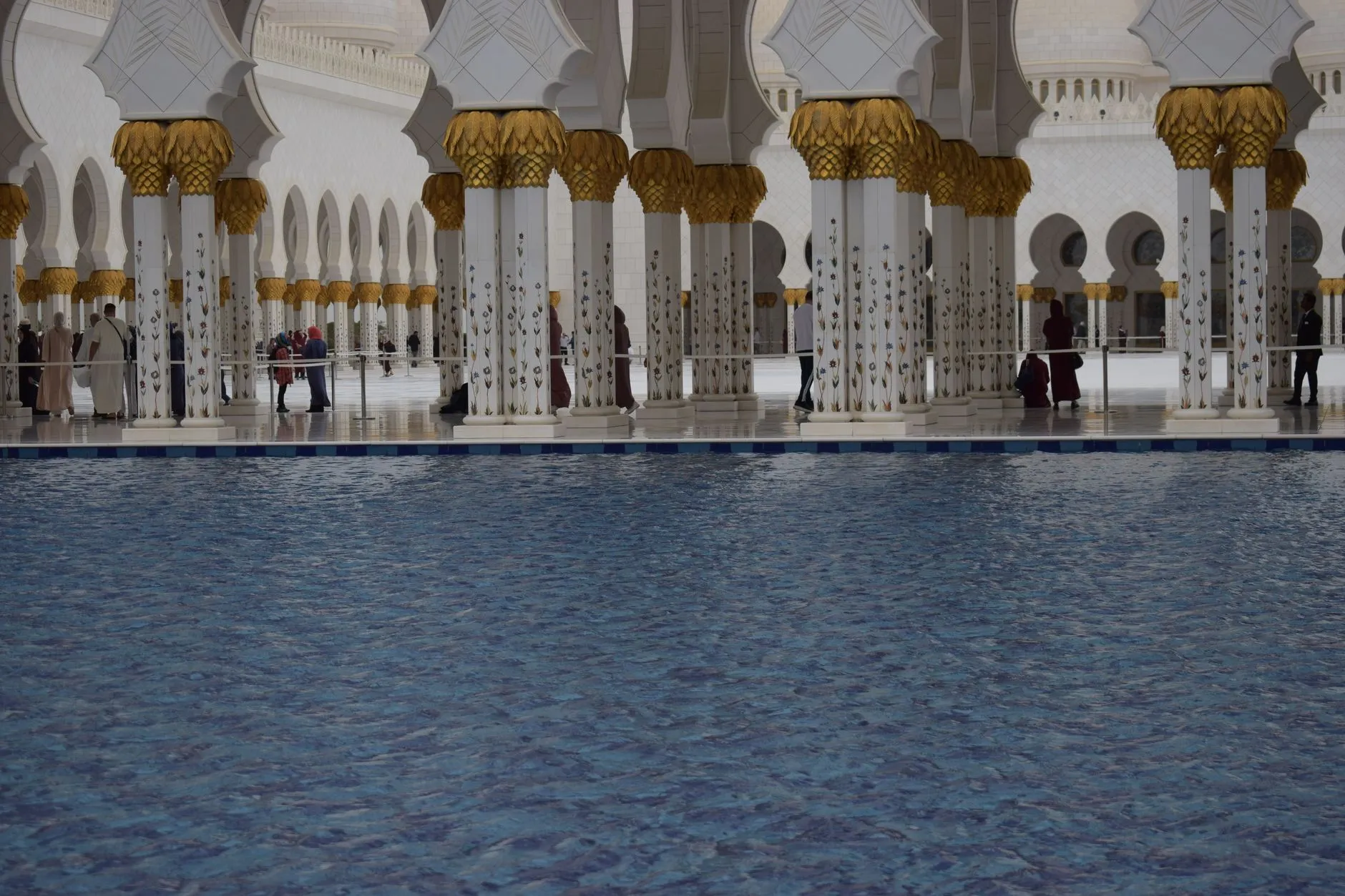 Interior courtyard of Sheikh Zayed Grand Mosque with white marble columns