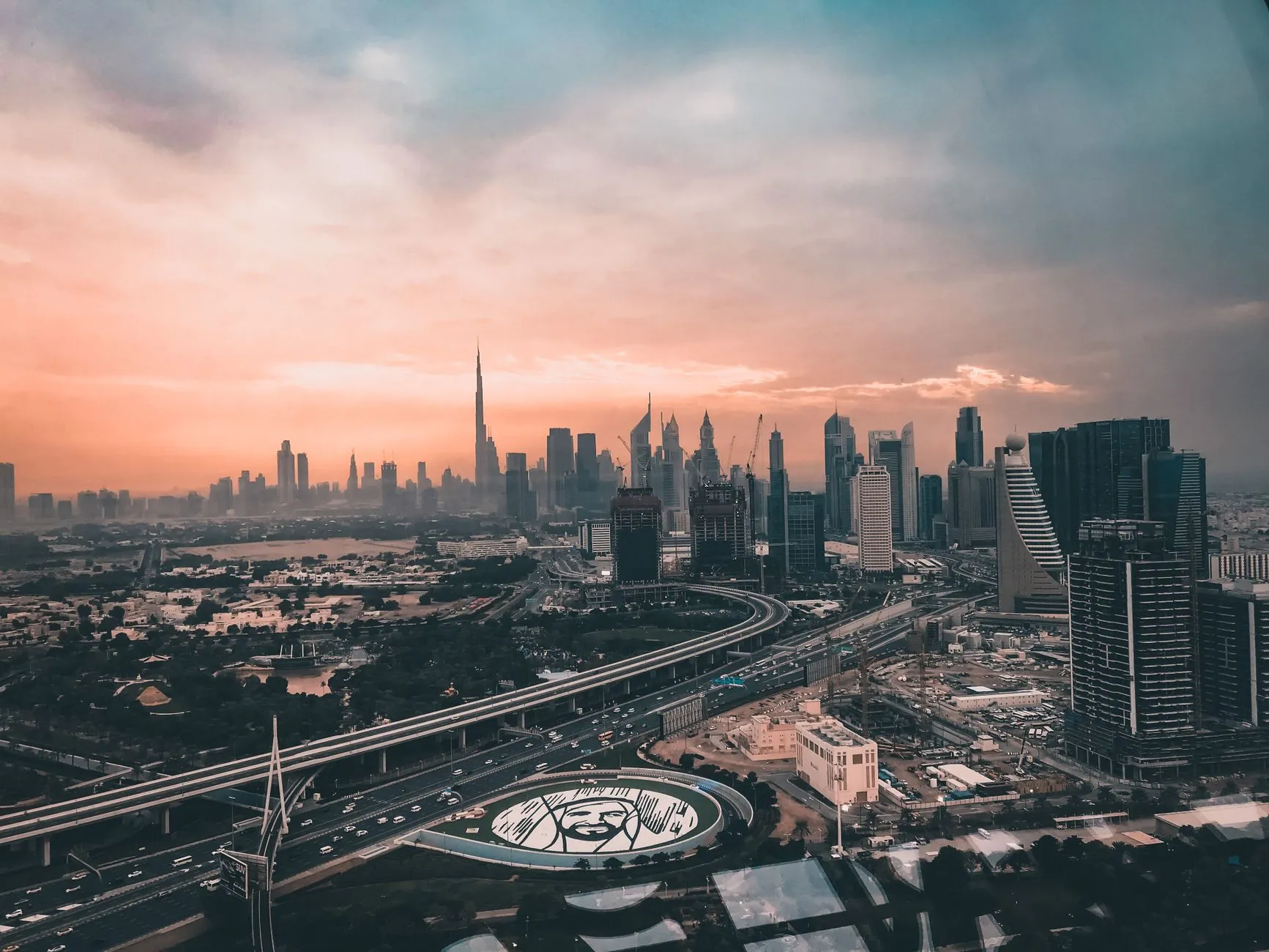 Aerial panorama of Dubai where desert meets glittering city skyline