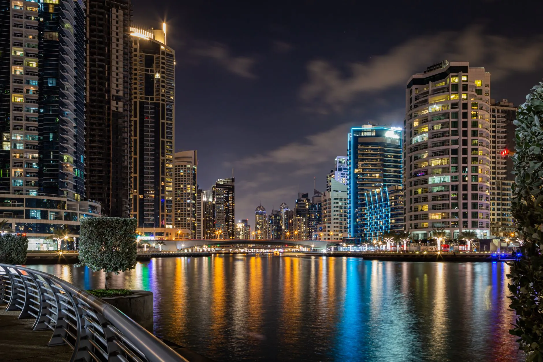 Dubai Marina skyline reflected in water at blue hour