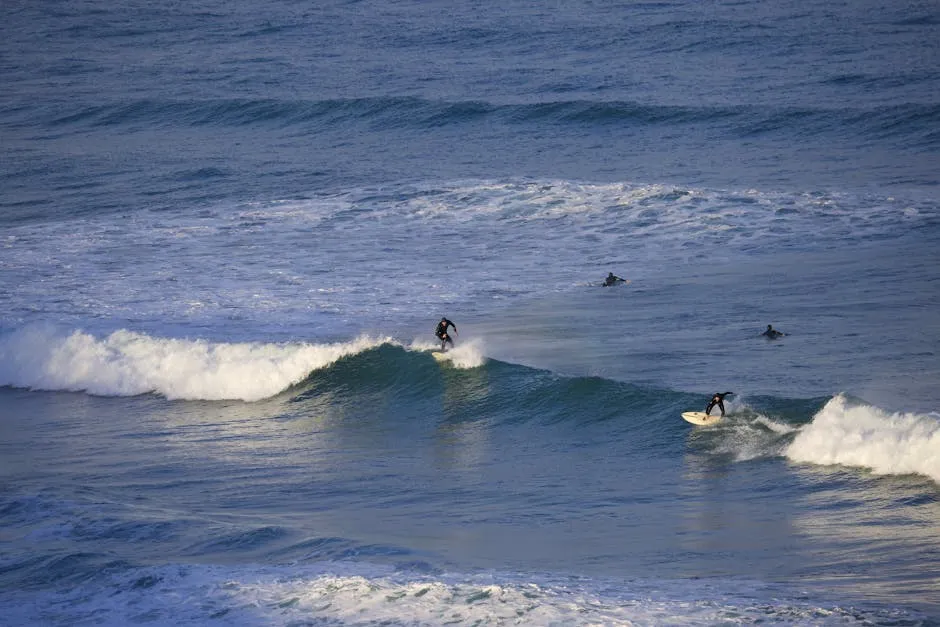 Fistral Beach in Newquay with surfers riding Atlantic waves