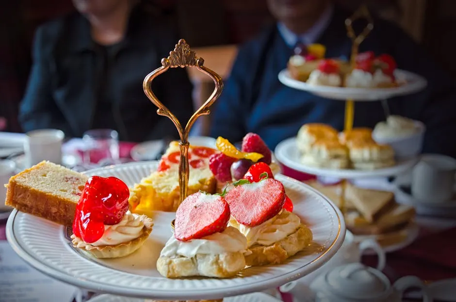 Tiered afternoon tea stand with scones, sandwiches and pastries