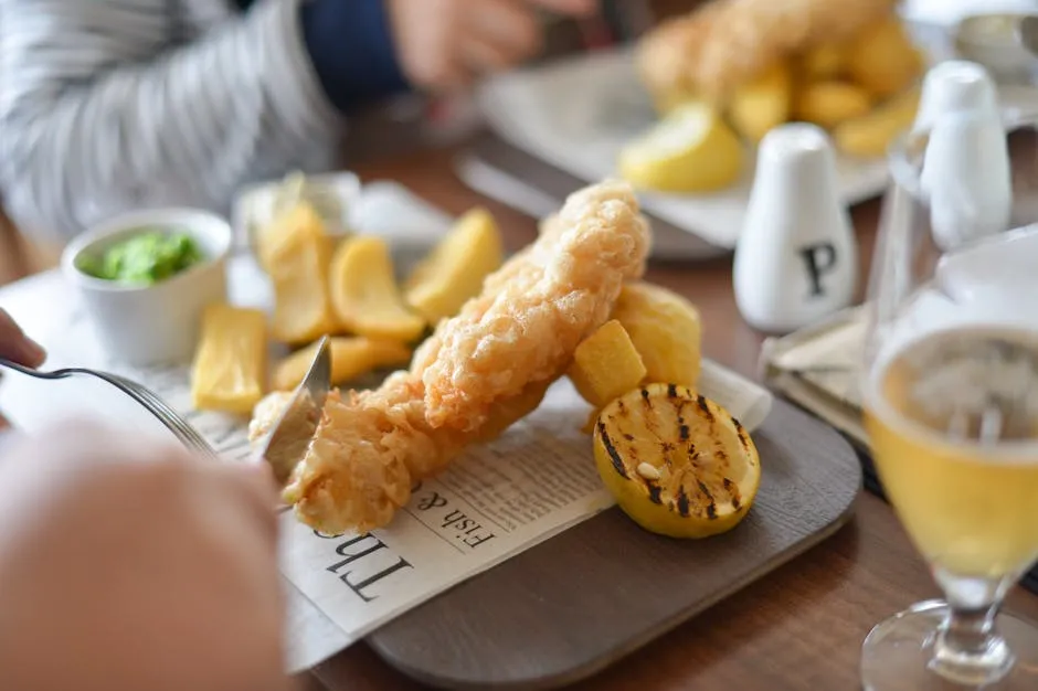 Golden battered fish and chunky chips with mushy peas
