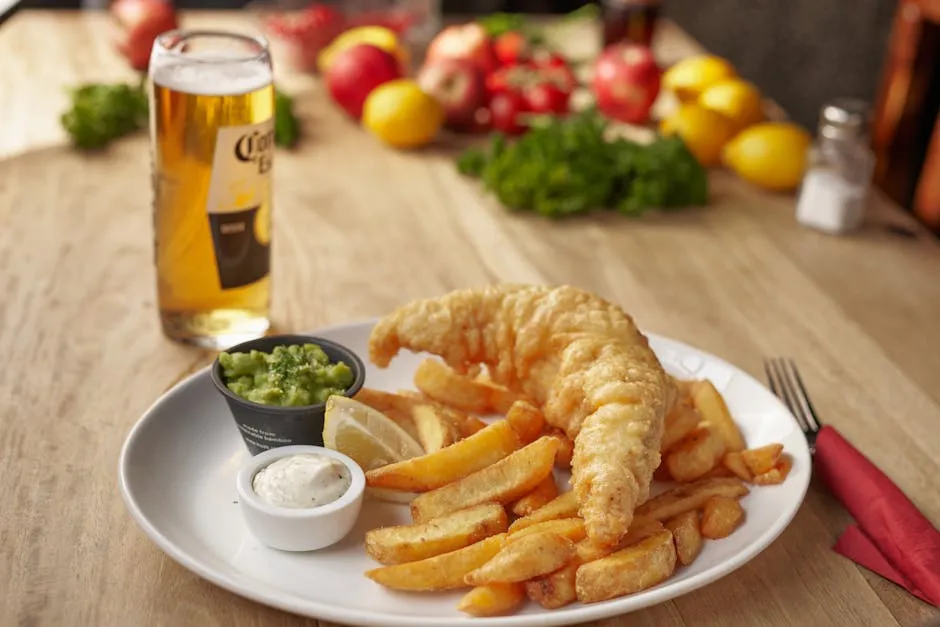 Steak and ale pie with golden pastry crust on a pub table