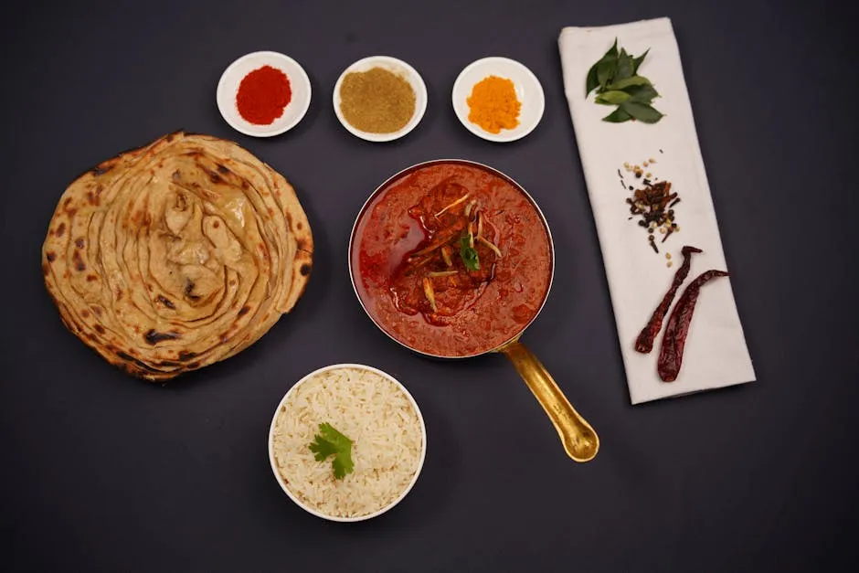 Chicken tikka masala with rice and naan bread