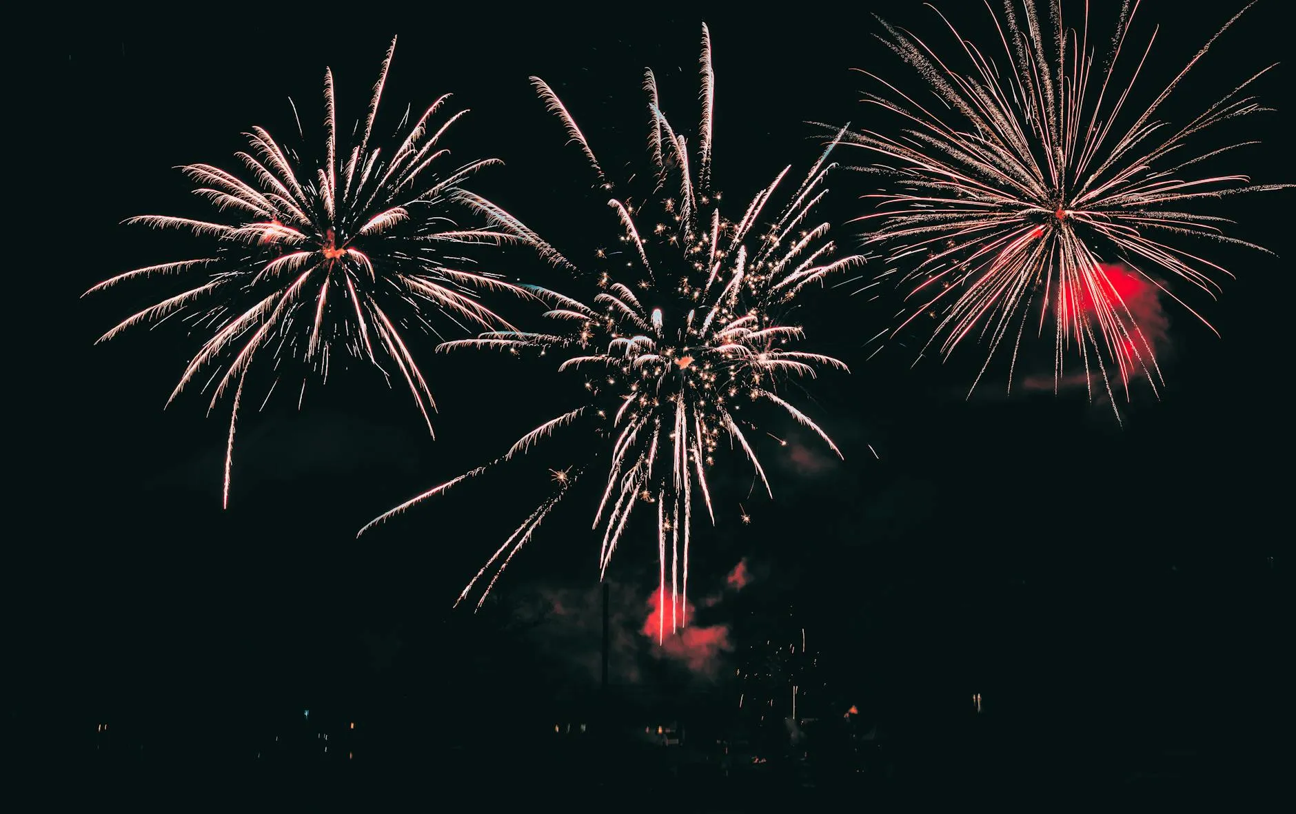 Bonfire Night fireworks illuminating a city skyline