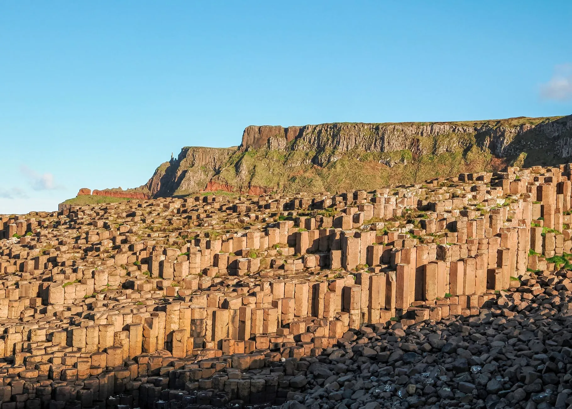 Giant's Causeway hexagonal basalt columns meeting the sea