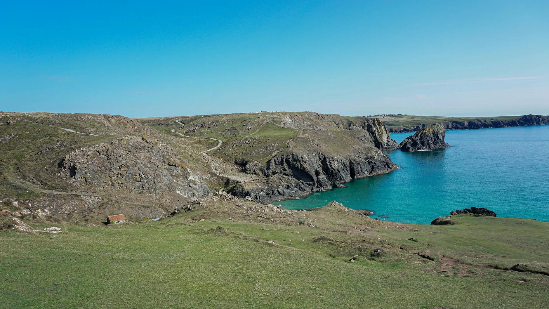 Dramatic Cornish coastline with turquoise sea and cliffs
