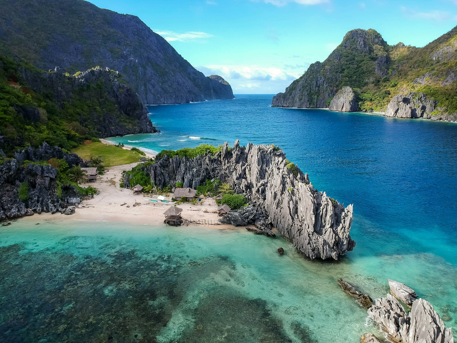Philippine island beach with traditional bangka boat